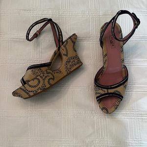 Alaia canvas wedges with navy detail.